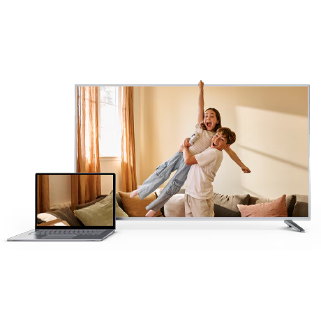 Laptop and TV screen displaying a home scene to represent Bell services.